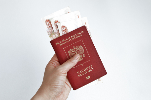 Russian-passport-with-5000-rubles-banknotes