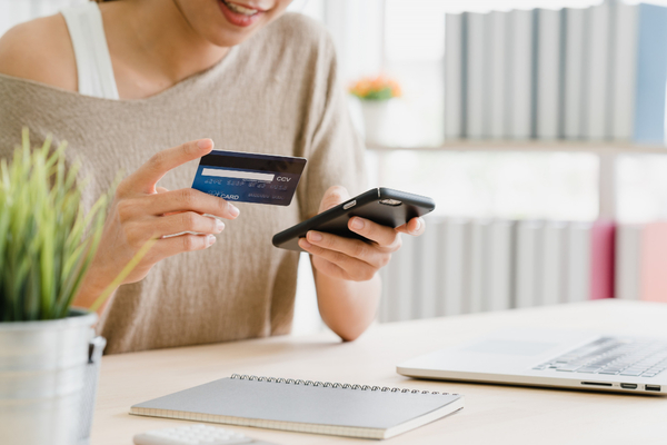 Card-transfer-woman-smartphone-buying-online-shopping